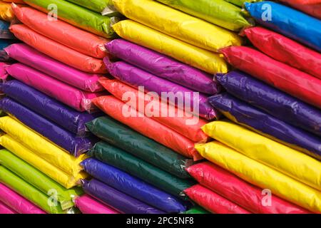 12 March 2023, Pune, India, Dry colours packed in plastic pack placed at market shop for sale for Indian Festival Holi. Stock Photo