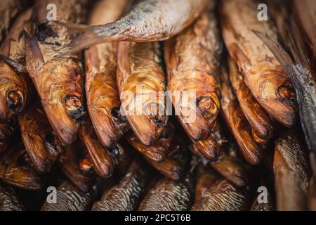 Dried smoked Atlantic or Baltic herrings, Clupea harengus, a herring in the family Clupeidae in a street food market in Vilnius, Lithuania, Europe Stock Photo