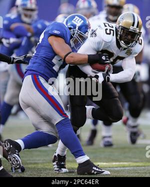 New Orleans Saints Reggie Bush breaks away from New York Giants Will Demps  in the 2nd quarter at Giants Stadium in East Rutherford, New Jersey on  December 24, 2006. The New York