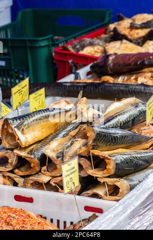 Selling various smoked fish in a street food market in Vilnius, Lithuania, Europe, close up Stock Photo