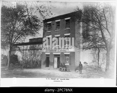 Front of 'slave pen,' Alexandria, Virginia. No. 244, Title from item, Inscribed on item: Building contained numerous cells and a whipping post, Original negative in National Archives Record Group 111: Records of the Office of the Chief Signal Officer, 1860-1985, Series: Mathew Brady Photographs of Civil War-Era Personalities and Scenes, 1921-1940, Item: Slave pen of Price, Birch & Co, Alexandria, Va, Published in: Russell's Civil War photographs : 116 historic prints / by Andrew J. Russell ; with a preface by Joe Buberger and Matthew Isenberg. New York : Dover Publications, c1982, no. 99. Slav Stock Photo