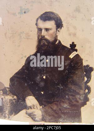 Unidentified soldier in Union captain uniform resting arm on table with kepi on top. Liljenquist Family Collection of Civil War Photographs , Exhibited: 'The Last Full Measure : Civil War Photographs from the Liljenquist Family Collection' at the Library of Congress, Washington, D.C, 2011, pp/liljunion. United States, Army, People, 1860-1870, Soldiers, Union, 1860-1870, Military uniforms, Union, 1860-1870, United States, History, Civil War, 1861-1865, Military personnel, Union. Stock Photo