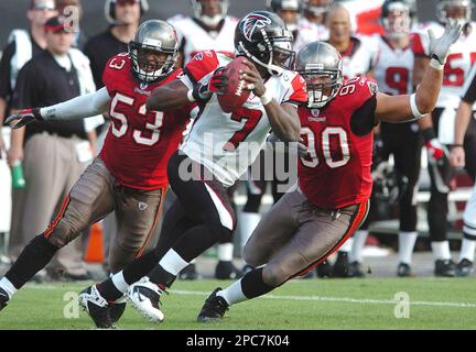 Tampa Bay Buccaneers' linebacker Shelton Quarles (53) tackles Seattle  Seahawks' running back Shaun Alexander as Seahawks' tight end Jerramy  Stevens (86) blocks Buccaneers' defensive end Greg Spires (94) at Raymond  James Stadium