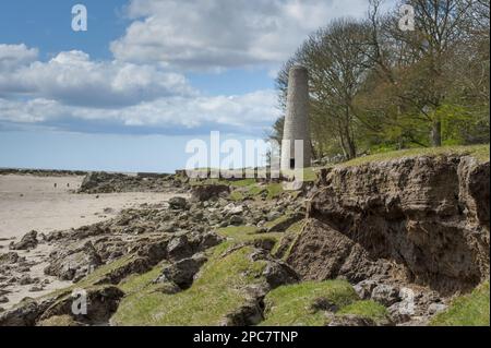 Coastal erosion near the chimney of an old ironworks near Jenny Brown's Point, Silverdale, factory near Jenny Brown's Point, Morecambe Bay Stock Photo