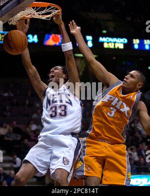 New Jersey Nets' Stephon Marbury goes up to dunk the ball in a