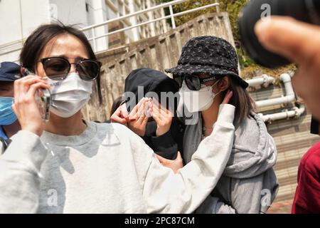 Irene Pun Hau-yin ( In black hoodie), the seventh suspect who is charged over allegedly trying to help Choi's ex-husband Alex Kwong Kong-chi in the brutal murder of model Abby Choi Tin-fung, leaves Kowloon City Court after she was granted bail. 08MAR23    SCMP / Elson Li Stock Photo