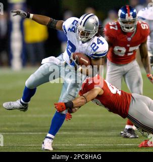 New Orleans Saints Reggie Bush breaks away from New York Giants Will Demps  in the 2nd quarter at Giants Stadium in East Rutherford, New Jersey on  December 24, 2006. The New York