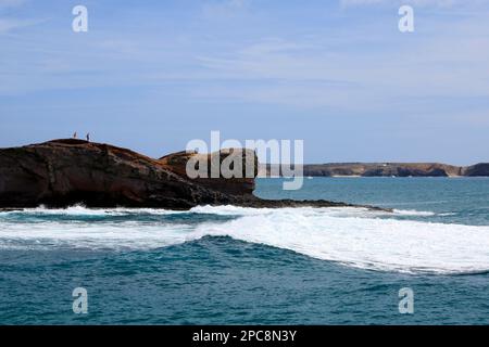 Rugged volcanic coastline and crashing waves, Las Coloradas, Playa Blanca, Lanzarote, Canary Islands, Spain. Stock Photo