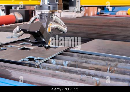 Plasma cutting machine working with sheet metal at metalworking exhibition Stock Photo