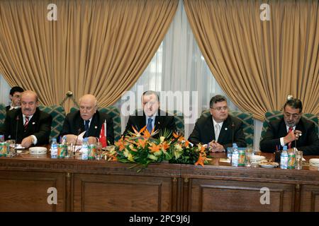 Turkish Prime Minister Recep Tayeb Erdogan, left, gestures during a ...