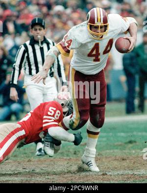 Washington Redskins full back John Riggins (44) runs over