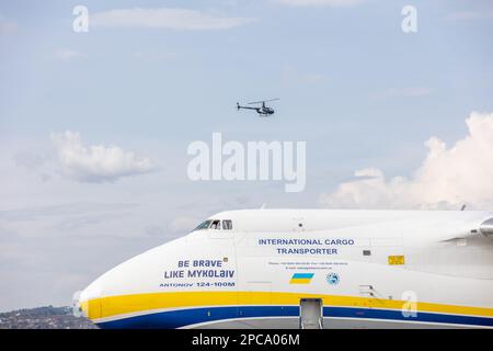 Kigali, Rwanda. 12th Apr, 2023. An Antonov 124-100M with the inscription 'Be Brave like Mykolaiv' lands at the international airport with special containers from Biontech on board. The arrival of the first special containers in Rwanda brings the vaccine production of the Mainz-based company Biontech on African soil a little closer. Six special shipping containers arrived by plane, according to Biontech. The six containers will form a so-called 'BioNTainer', a modular production unit, in a hall on a Biontech site in a special economic zone in Kigali. Credit: Jean Bizi/dpa/Alamy Live News Stock Photo