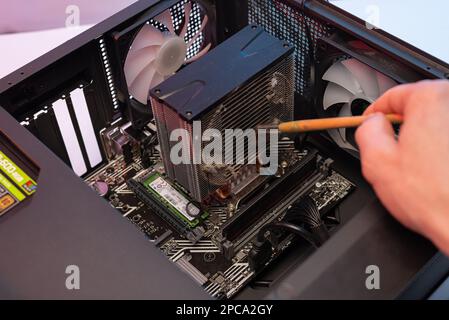 Dirty cooler ventilation system unit computer, cleaning from dust. Stock Photo