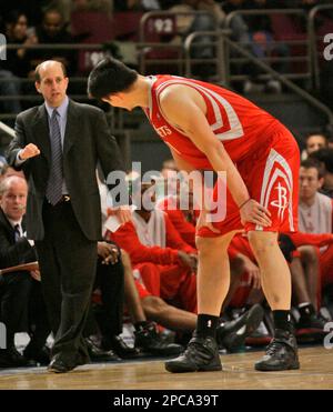 Houston Rockets head coach Jeff Van Gundy, left, gives Yao