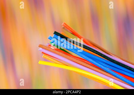Close-up shot of tuft of multi-colored narrow gauge electrical wires. For colour identification, electrical complexity. Stock Photo