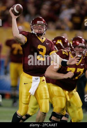 Minnesota quarterback Bryan Cupito left gets some protection from