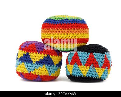 three multicolored crocheted hacky sack balls isolated on a white background Stock Photo
