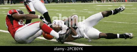 Atlanta Falcons' Alge Crumpler (83) scores on a 18 yard touchdown pass from  quarterback Michael Vick as the Los Angeles Rams' Adam Archuleta (31)  defends in the first quarter of their NFC