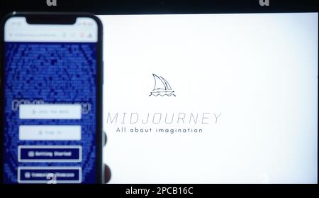 Mobile phone with Midjourney website artificial intelligence program on screen in front of a gallery homepage. Stock Photo