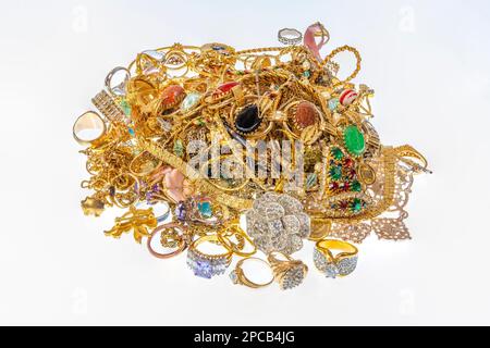 Horizontal shot of a colorful pile of beautiful vintage gold jewelry. Stock Photo