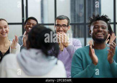 Young woman coach speaker giving flipchart presentation Stock Photo