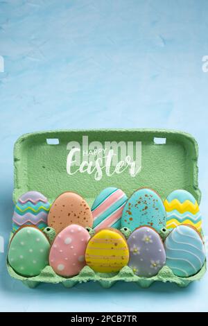 Homemade ginger cookies for Easter. Egg-shaped cookies placed in an egg tray. Easter holiday concept. Stock Photo