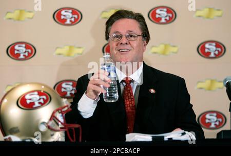 San Francisco, United States. 21st Oct, 2003. San Francisco 49ers owner  John York congratulates offensive tackle Kwame Harris after 24-7 victory  over the Tampa Bay Buccaneers at 3COM Park in San Francisco