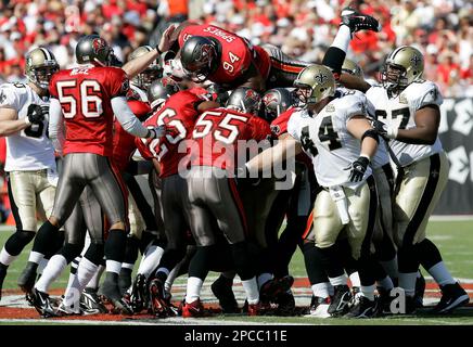 Tampa Bay Buccaneers' linebacker Shelton Quarles (53) tackles Seattle  Seahawks' running back Shaun Alexander as Seahawks' tight end Jerramy  Stevens (86) blocks Buccaneers' defensive end Greg Spires (94) at Raymond  James Stadium