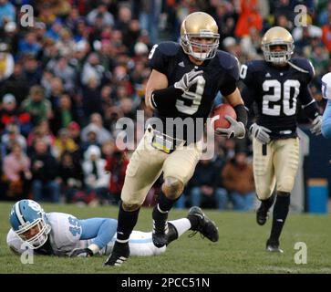 https://l450v.alamy.com/450v/2pcc51n/notre-dame-safety-tom-zbikowski-center-heads-to-the-end-zone-on-a-52-yard-punt-return-after-getting-past-north-carolina-punter-david-wooldridge-left-in-the-second-quarter-of-college-football-action-in-south-bend-ind-saturday-nov-4-2006-ap-photojoe-raymond-2pcc51n.jpg