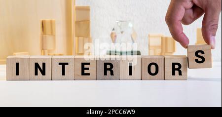 Diverse team of skilled young people learning foreign words from colorful stickers glued on glass wall during collaborative process in office interior Stock Photo