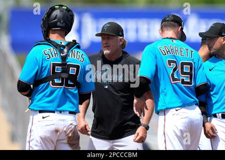 Miami Marlins pitching coach Mel Stottlemyre, center, talks with pitcher  Elieser Hernandez (57) during the first inning of the team's baseball game  against the Pittsburgh Pirates, Friday, Sept. 17, 2021, in Miami. (