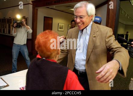 Rep. John Barrow D Ga right hugs friend and poll worker Rose