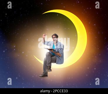 The student reading book on the moon crescent Stock Photo