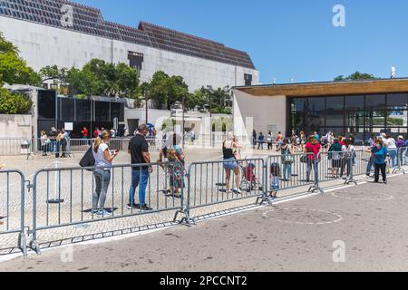 Fatima, Santarem, Portugal - June 26, 2021: Pilgrims queuing outside the Chapel of the Apparitions (Capelinha das Aparicoes) of the Sanctuary of Fatim Stock Photo