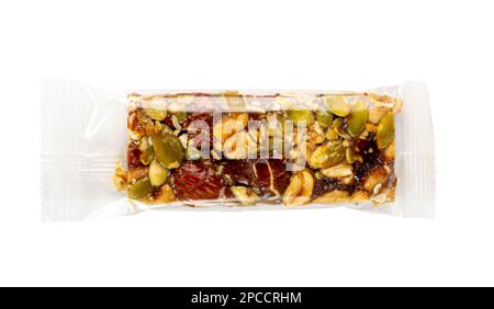 Nut Bar in Plastic Package Isolated, Energy Snack with Nuts, Muesli, Protein Candy Bar, Fitness Fruit and Nut Mix on White Background, Clipping Path Stock Photo