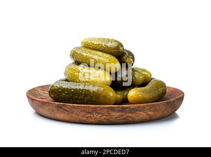 Pickled Cucumbers on Wood Plate Isolated. Fermented Food, Marinated Canned Vegetables, Gherkins, Pickled Cucumbers on White Background Side View Stock Photo