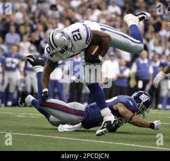 New Orleans Saints Reggie Bush breaks away from New York Giants Will Demps  in the 2nd quarter at Giants Stadium in East Rutherford, New Jersey on  December 24, 2006. The New York