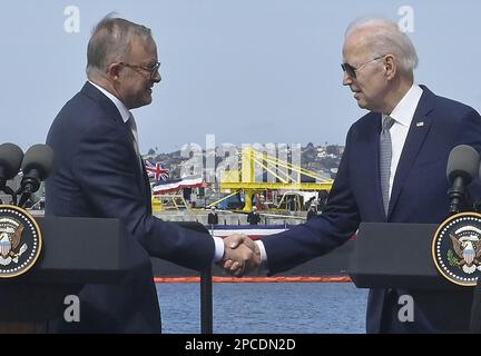 San Diego, United States. 13th Mar, 2023. President Joe Biden (R), shakes hands with Australian Prime Minister Anthony Albanese as the two leaders and British Prime Minister Rishi Sunak (not seen) discuss an initiative to create a new fleet of nuclear-powered submarines during an event at Naval Base Point Loma in San Diego, California on Monday, March 13. 2023. The Australia-United Kingdom-US (AUKUS) partnership is a trilateral security pact formed in 2021. Photo by Jim Ruymen/UPI Credit: UPI/Alamy Live News Stock Photo