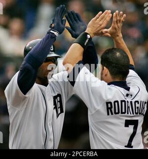 Detroit Tigers Craig Monroe is congratulated by teammate Curtis