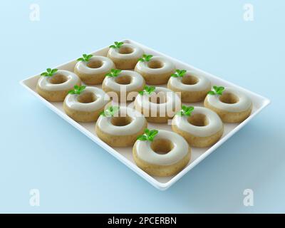 Healthy sweets, vegan donuts with mint leaves. Mint milk delicious donut on a tray isolated on a pastel blue background. Assortment of donates Stock Photo