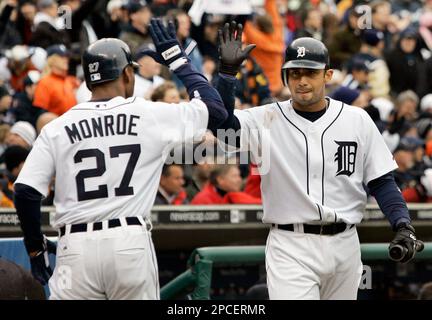 Detroit Tigers Craig Monroe is congratulated by teammate Curtis
