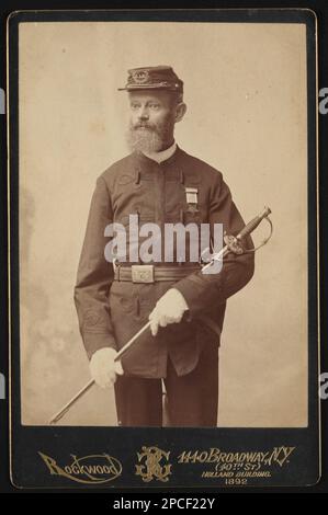 Civil War veteran of Post No. 307 New York City. in uniform with badge and G.A.R. insignia on cap and G.A.R. sword / Rockwood, 1440 Broadway, New York (40th St.), Holland Building, 1892.. Liljenquist Family Collection of Civil War Photographs , pp/liljvet. Grand Army of the Republic, Department of New York, People, 1890-1900, United States, Army, People, 1890-1900, Veterans, Union, New York (State), 1890-1900, Daggers & swords, 1890-1900, Buckles, 1890-1900, United States, History, Civil War, 1861-1865, Veterans, Union. Stock Photo