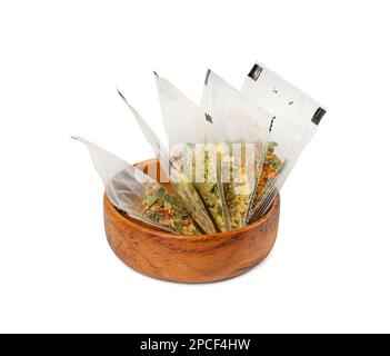Small Spice Pouch Isolated, Dried Vegetables and Herbs Mix in Plastic Bag, Dry Peas, Greens, Dehydrated Food Pieces on White Background, Clipping Path Stock Photo