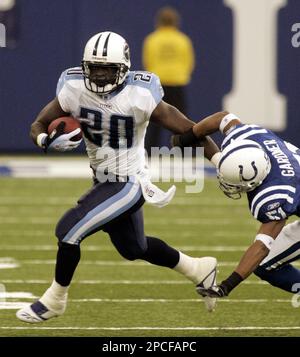 Tennessee Titans running back Travis Henry (#20) gives Philadelphia Eagles  cornerback Sheldon Brown (#24) a stiff arm to keep him away as he runs for  43 yards to the Philadelphia 16-yard line