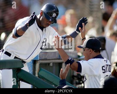 Detroit Tigers Craig Monroe is congratulated by teammate Curtis