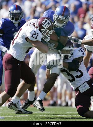 Texas A&M defenders Melvin Bullitt (33) and Danny Gorrer (4) leap for a  ball intended for Texas receiver Billy Pittman (2) during the second  quarter of their football game in Austin, Friday