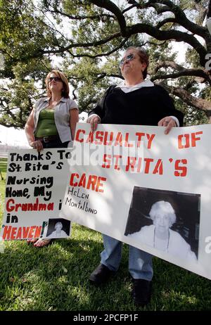 Michelle Stogner left and Linda Stogner Montalbano hold signs