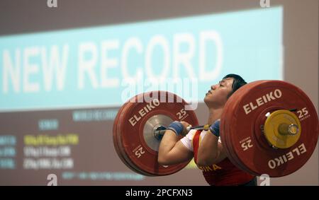 China s Hongxia Qiu lifts 128 kgs 282 lbs to set a new world record in the clean and jerk modality of the women s 53 kgs 117 lbs category at the World Weightlifting