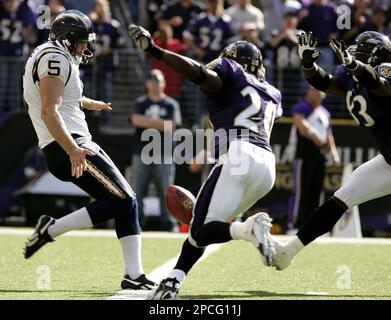 Baltimore Ravens' Ed Reed, center, rushes upfield with blockers Edgerton  Hartwell, left, Chris McAllister, foreground right, and Adalius Thomas  during the third quarter against the Miami Dolphins Sunday, Jan. 2, 2005, in