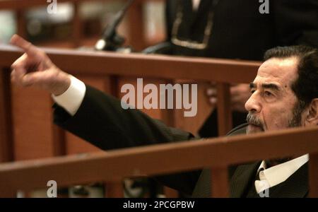 Saddam Hussein argues with Chief Judge Raouf Rashid Abdel-Rahman, not ...